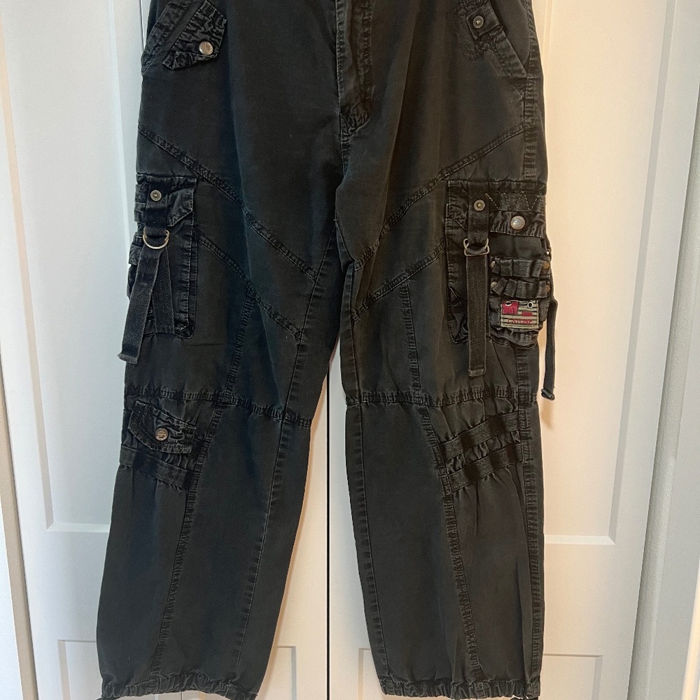 Black distressed jeans with lots of detail, buckles, straps. Size 34x32